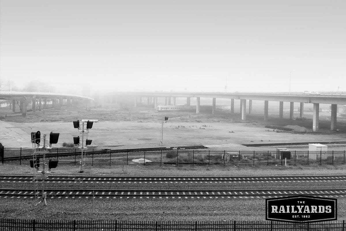 A black and white photo of the train tracks near the Railyards. Learn more about Sacramento's origins with the Railyards.
