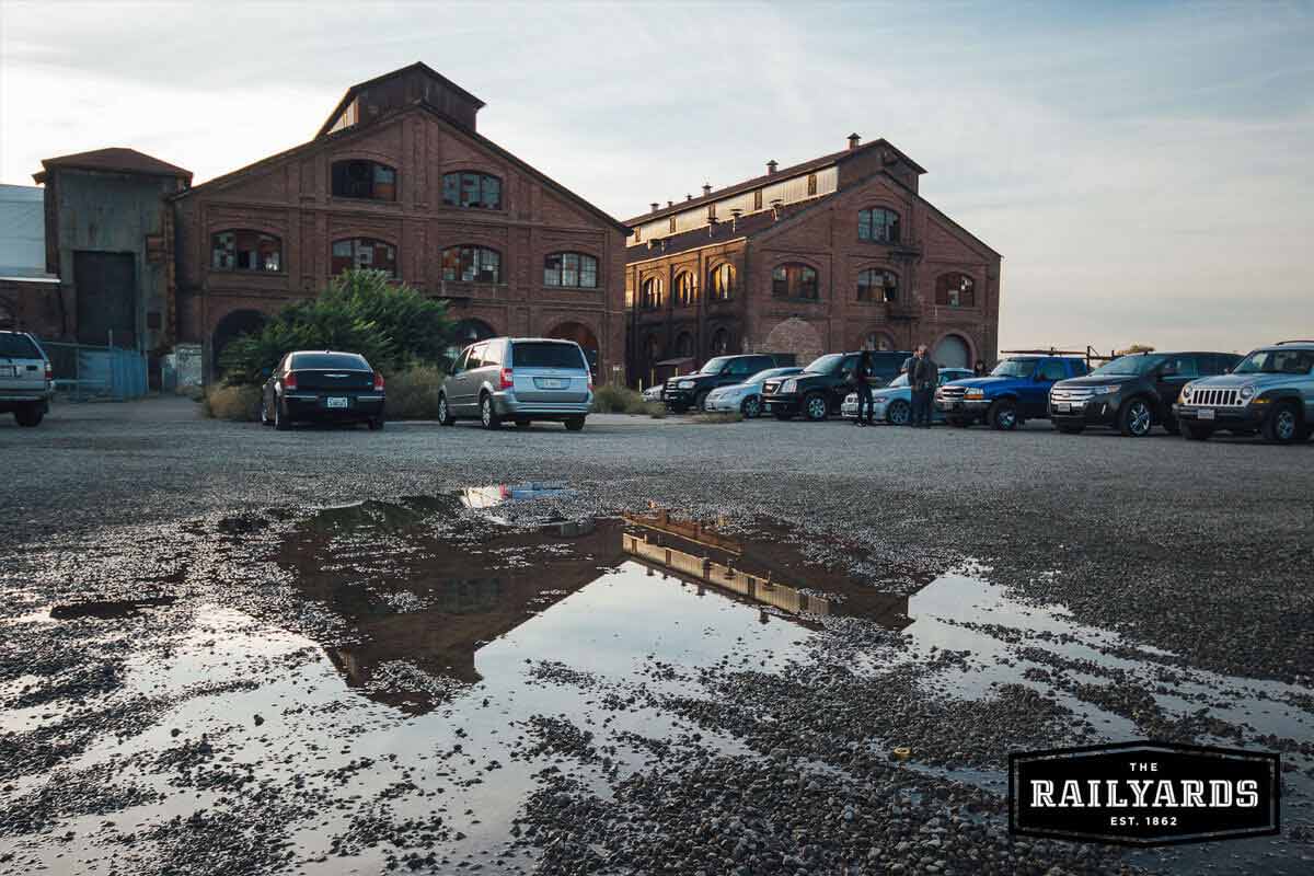 Cars parked in a lot at the Railyards. Learn more about the plan for parking.