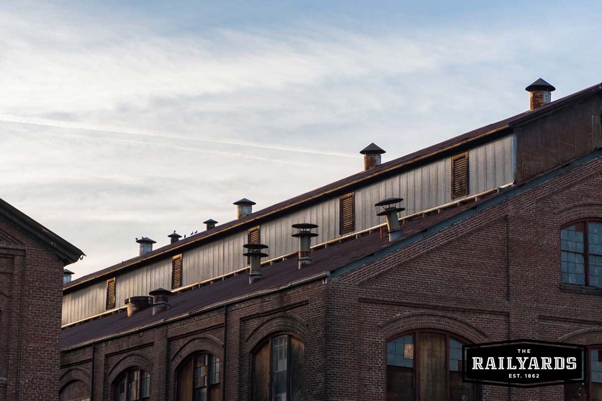 Sunlight shines on the rooftops of The Central Shops at The Railyards.
