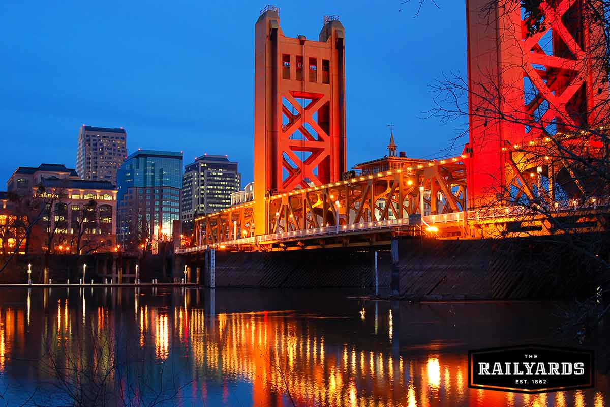 Sacramento’s tower bridge lit up at sunset.