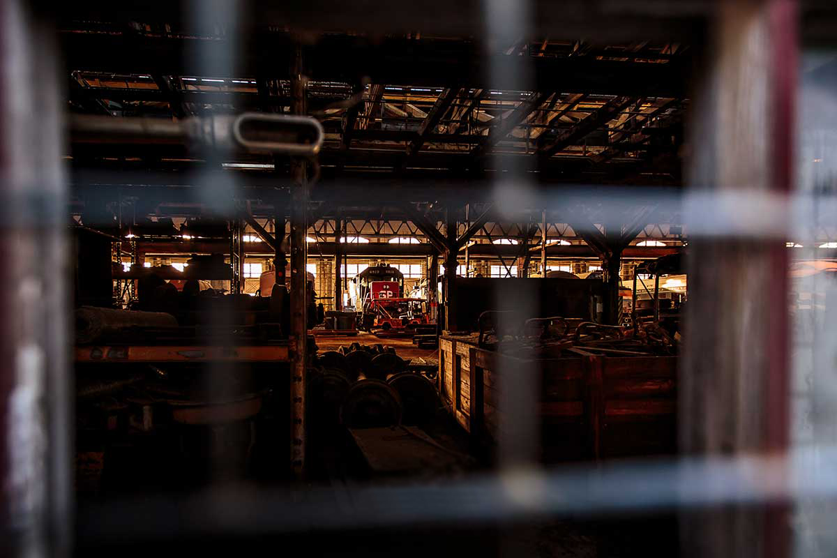 A view looking through a window into the interior of a historic Sacramento Railyard building.