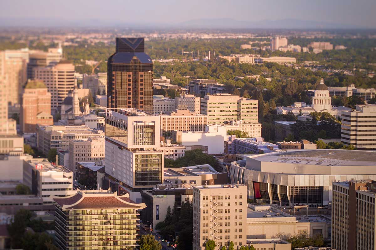 Aerial drone photography of Downtown Sacramento skyline. Find out how many new Sacramento jobs are coming to the region.